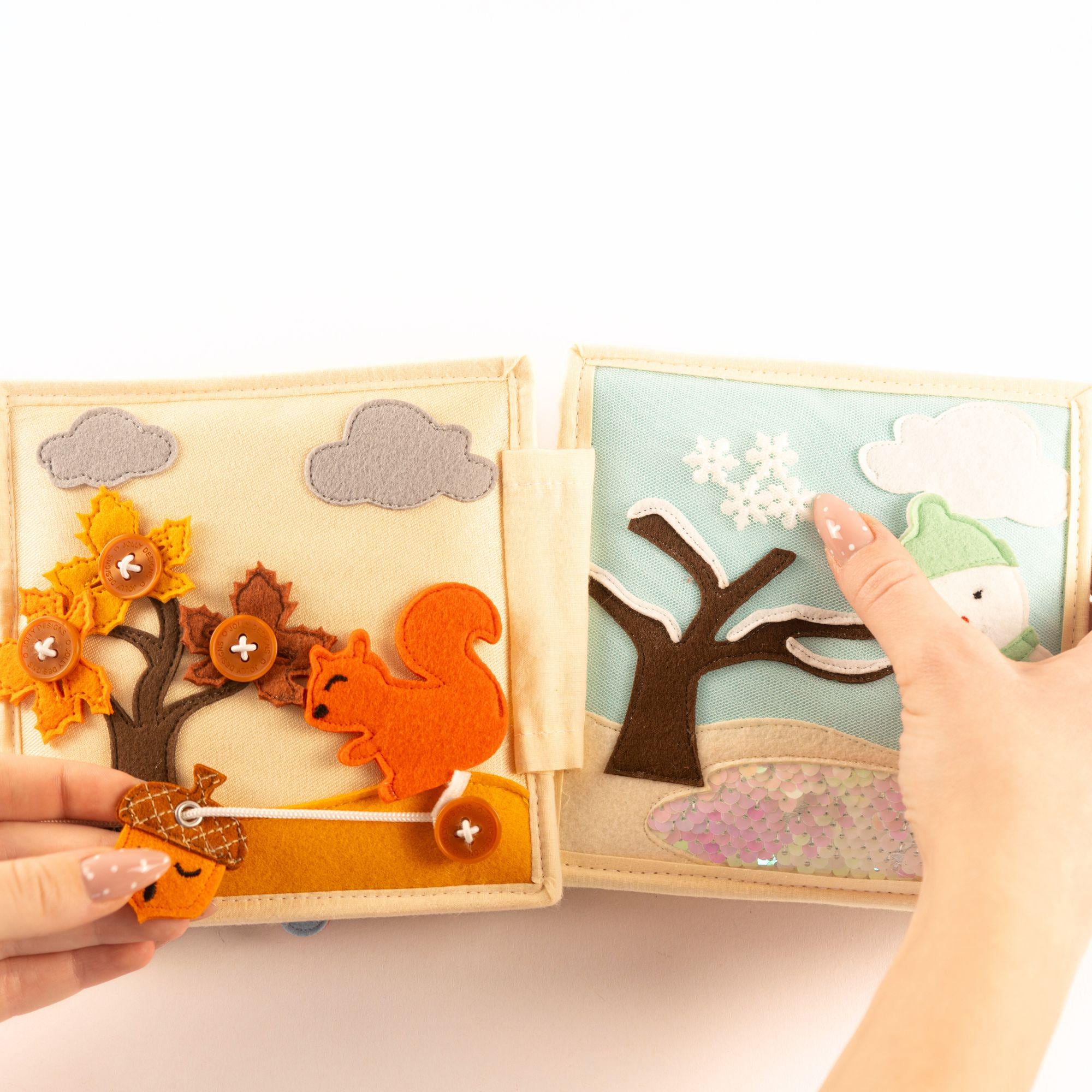 Mini Quiet Book Schneeflocke bis Sonnenschein  Stoffbuch zum Anziehen, Jahreszeiten lernen & Selbstständigkeit fördern